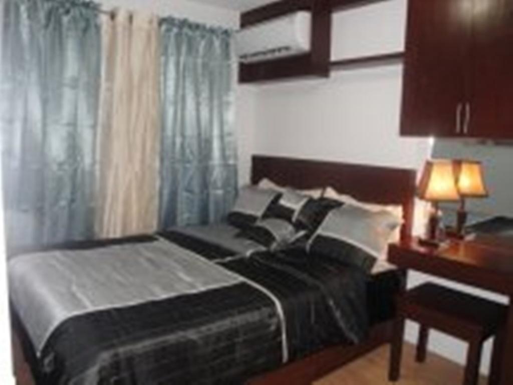 The Oasis Davao Condotel Habitación foto